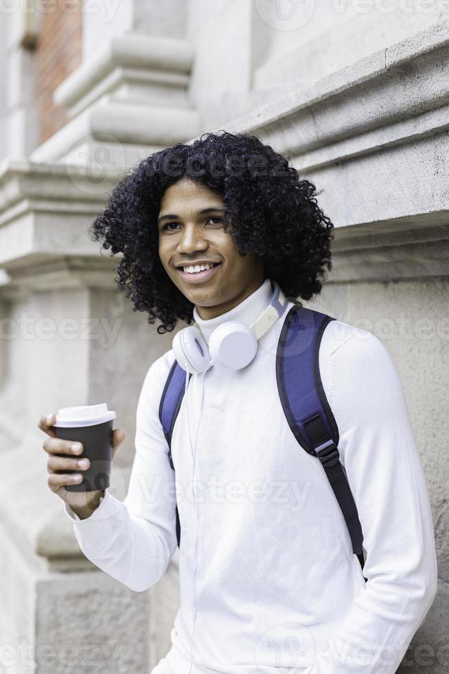 Portrait of a happy african american holding coffee photo