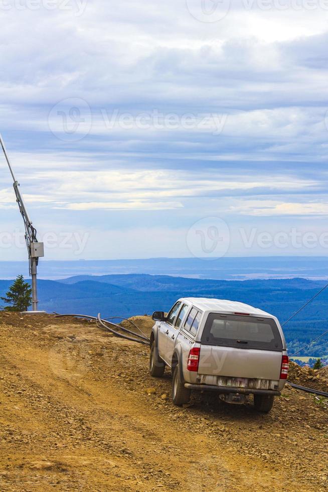 Car with view to landscape of Wurmberg Braunlage Harz Germany. photo