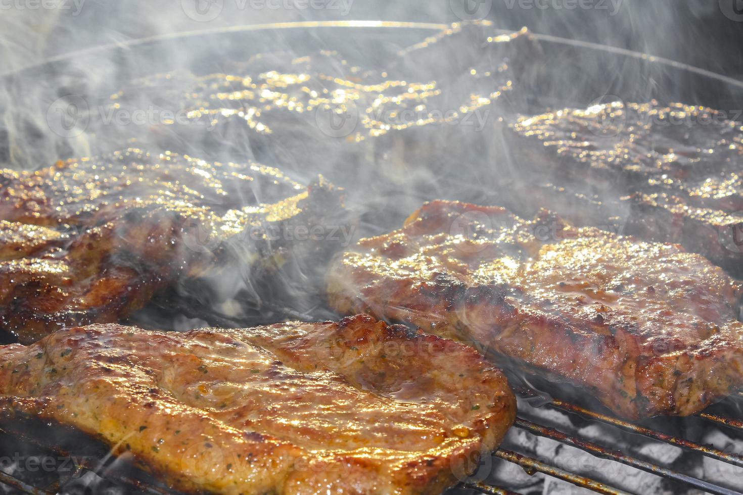 Preparing Barbeque BBQ Campfire and sausages meat steak chicken Germany. photo