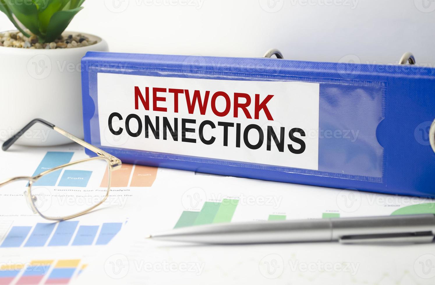 Network Connections - text concept on blue file folder and charts photo