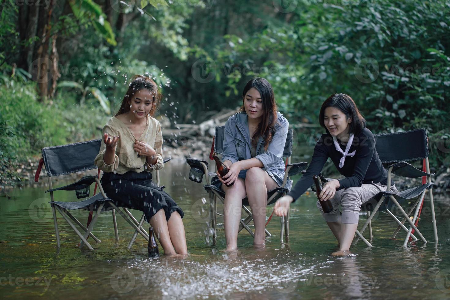 group of Asian girls enjoying a day at the  during holiday camping photo