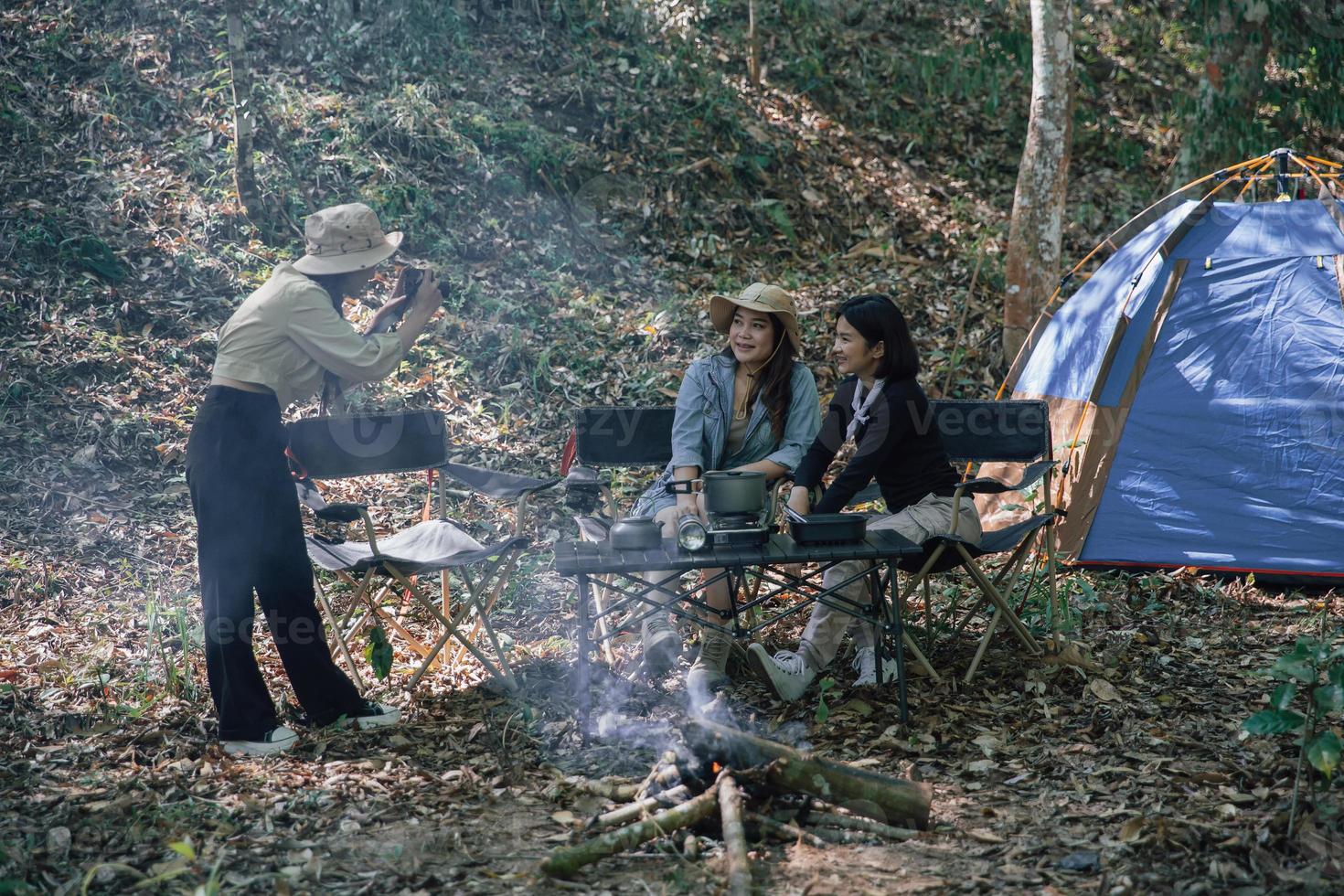 camping tent camp in nature happy friends photo