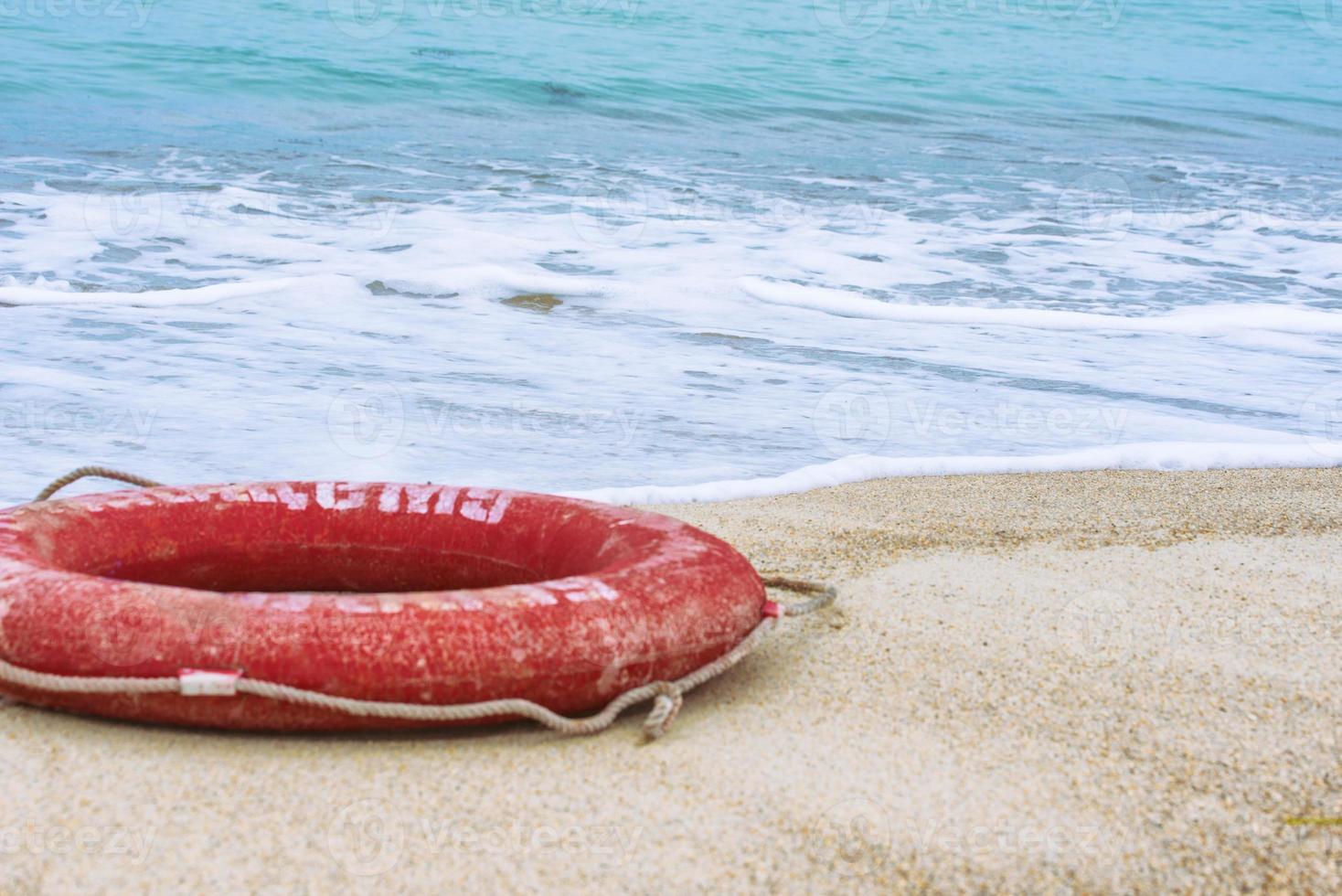 Lifebuoy on the beach photo