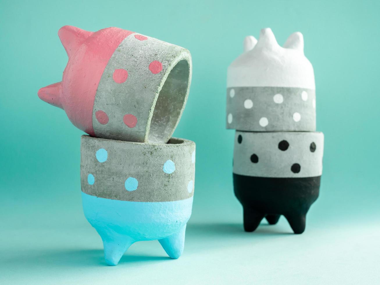 Colorful polka dot concrete planters. Painted concrete planters for home decoration photo