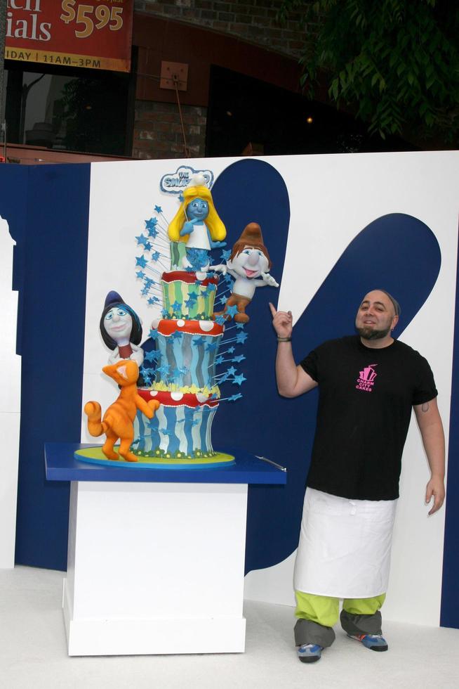 LOS ANGELES, JUL 28 - Duff Goldman with the Smurfs 2 cake by Charm City Cakes arrives at the Smurfs 2 Premiere at the Village Theater on July 28, 2013 in Westwood, CA photo