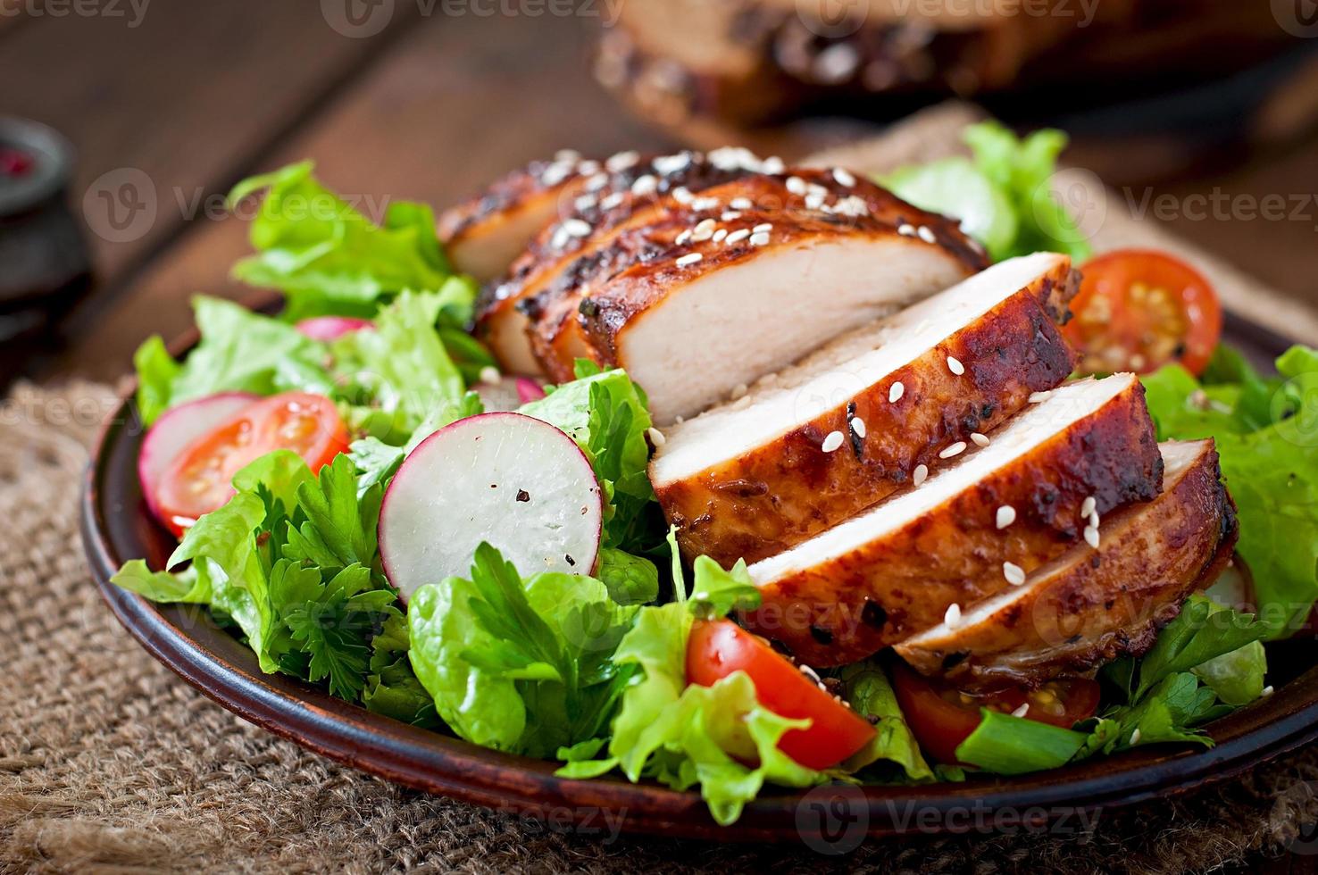 Fresh vegetable salad with grilled  chicken breast. photo