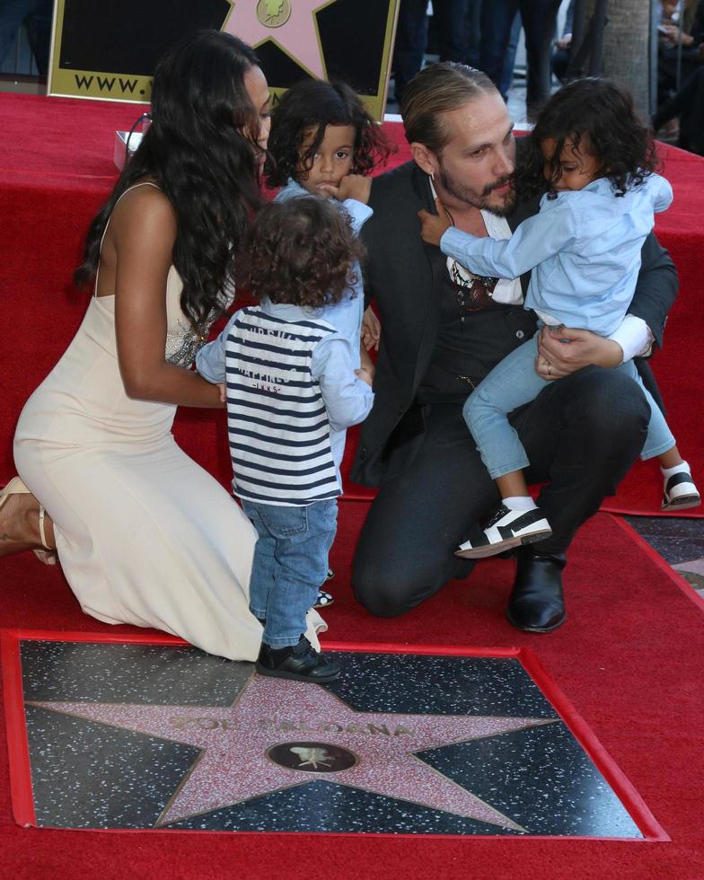 LOS ANGELES  MAY 3 - Zoe Saldana, Marco Perego, sons at the Zoe Saldana Star Ceremony on the Hollywood Walk of Fame on May 3, 2018 in Los Angeles, CA photo