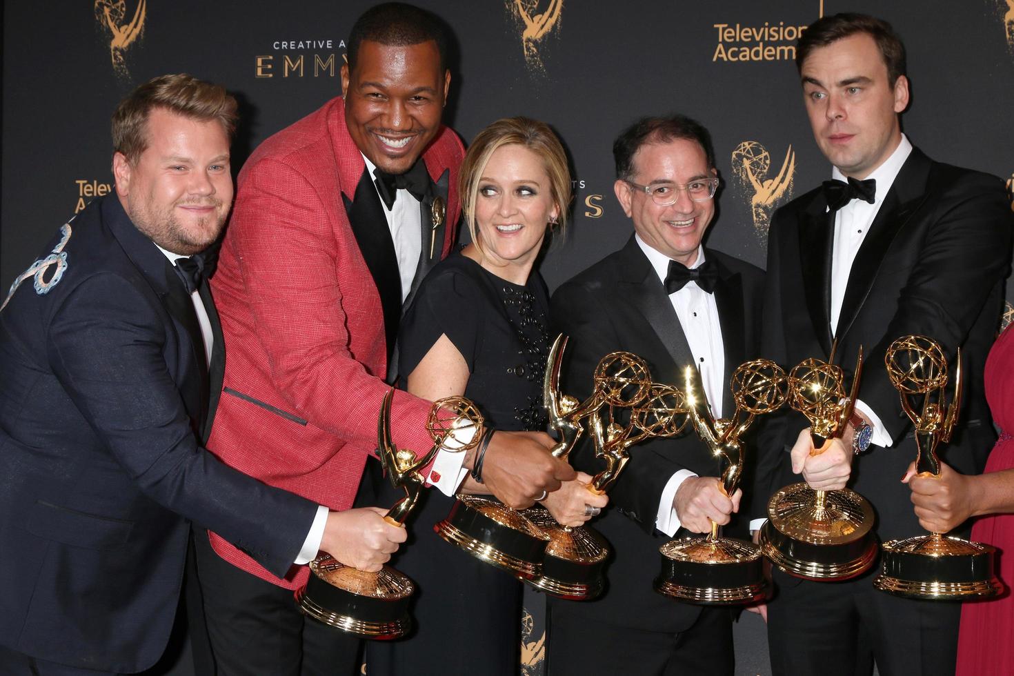 LOS ANGELES - SEP 9  James Corden photobombing Samantha Bee Show Writing Team at the 2017 Creative Emmy Awards Press Room at the Microsoft Theater on September 9, 2017 in Los Angeles, CA photo