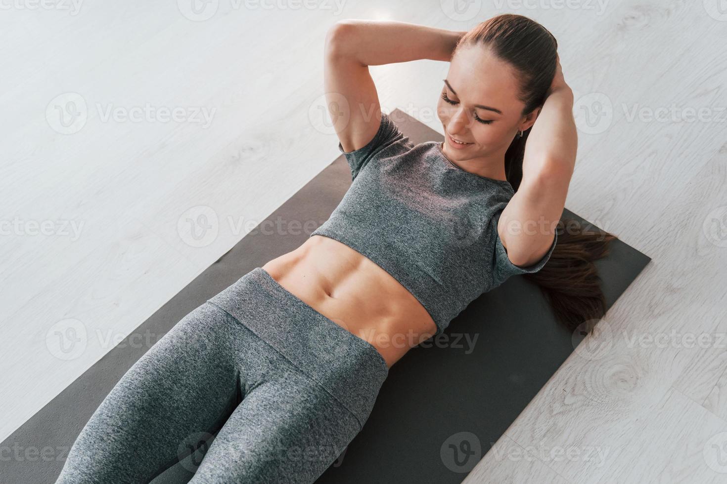 Exercises for spine. Young woman with slim body type and in yoga