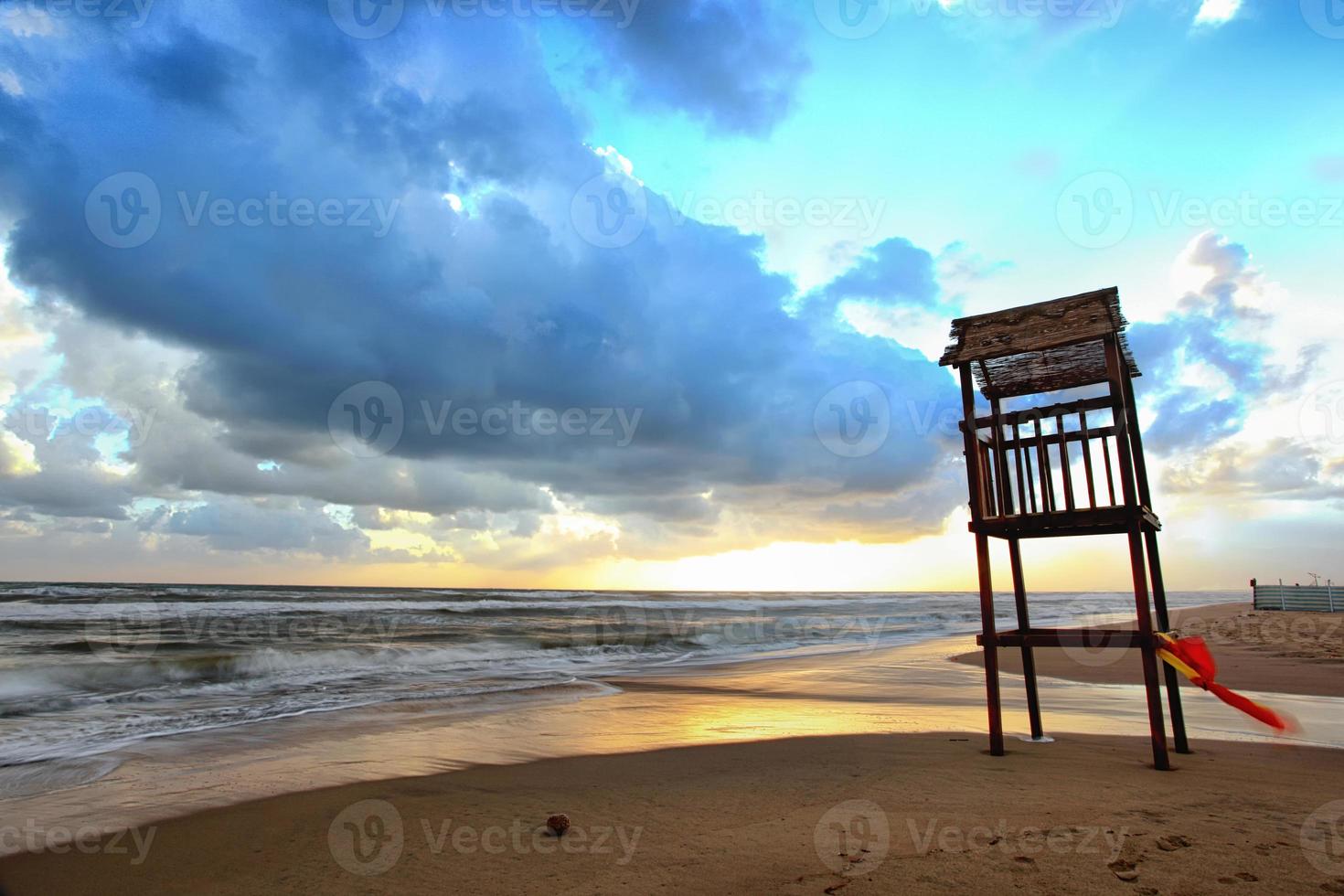 Landscape of beach with the wooden lookout tower photo