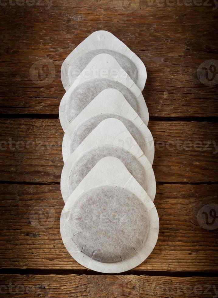 Coffee pods on wooden table photo