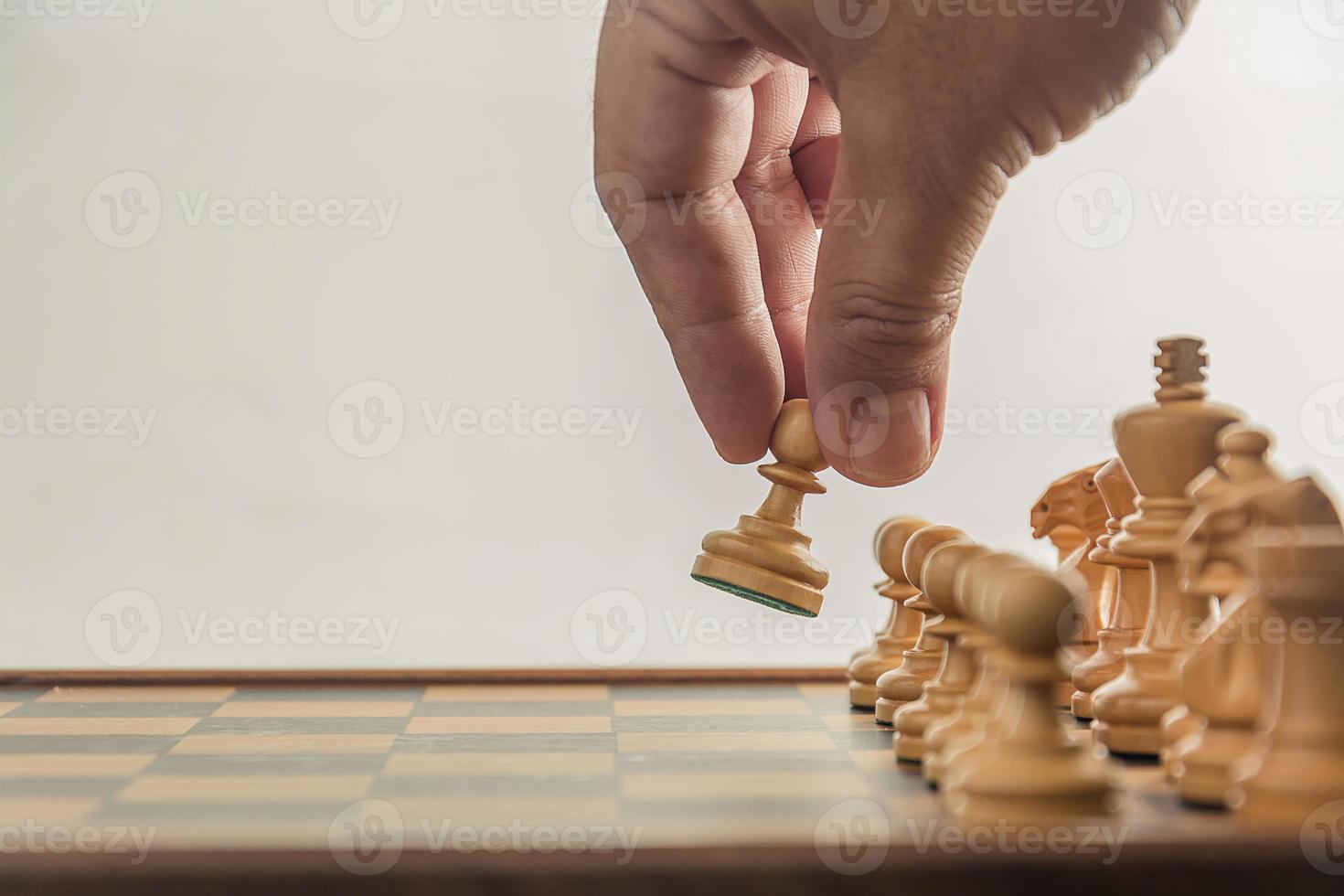 Chess on board with hand , white background photo