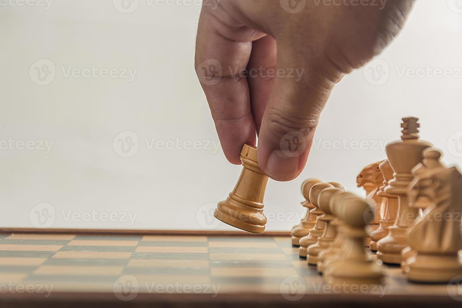 Chess on board with hand , white background photo