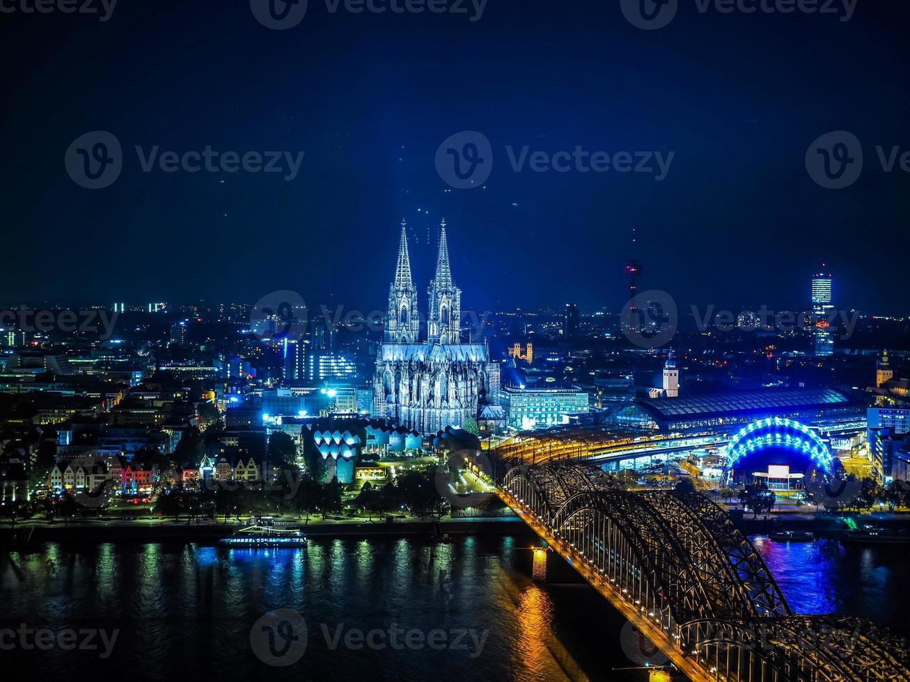 HDR Aerial night view of St Peter Cathedral and Hohenzollern Bri photo