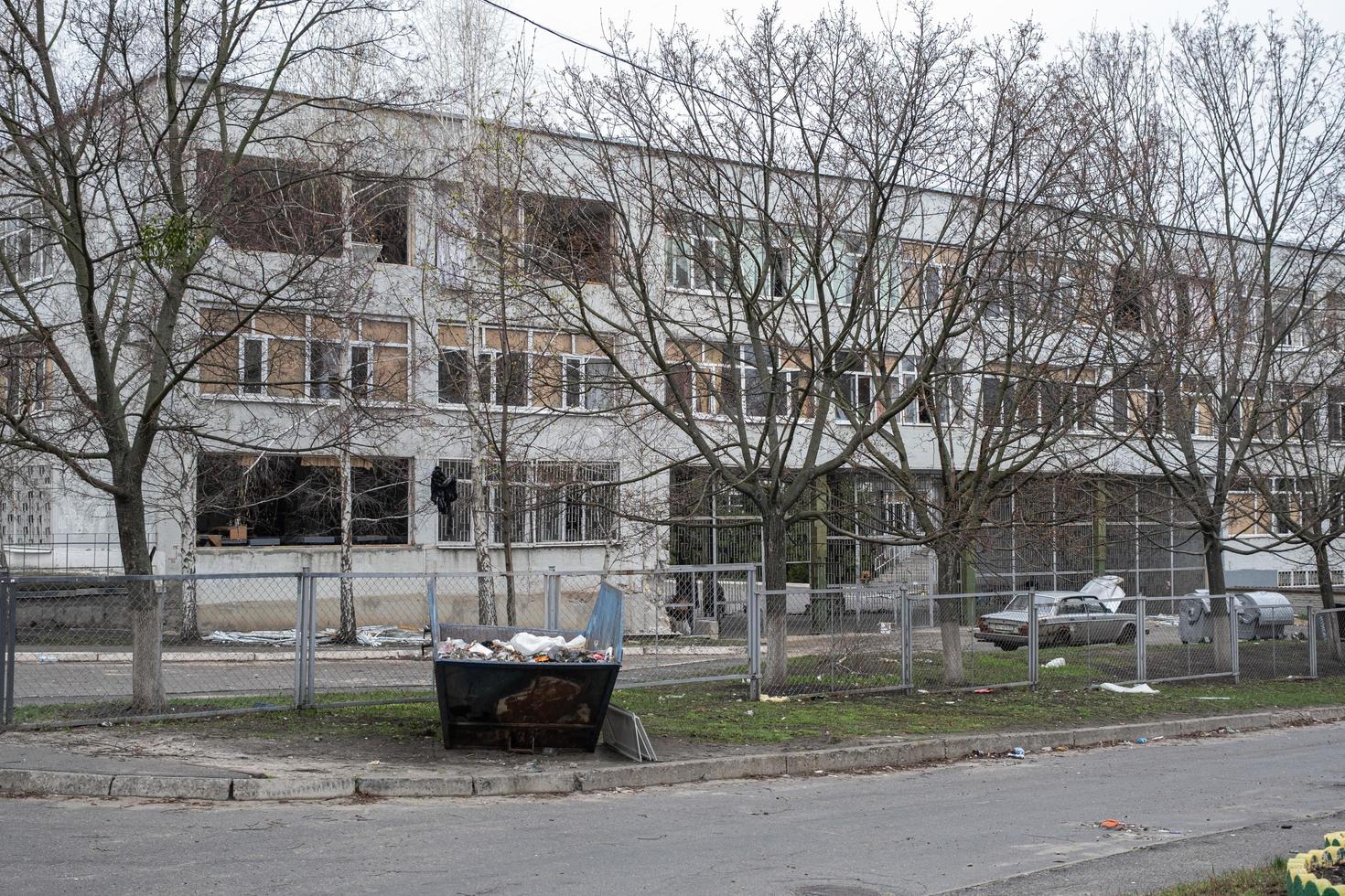 KHARKIV, UKRAINE - May, 04, 2022. War in Ukraine 2022. Destroyed, bombed and burned school building after Russian missiles in Kharkiv Ukraine. Russian aggression, conflict. Russian attack on Ukraine. photo