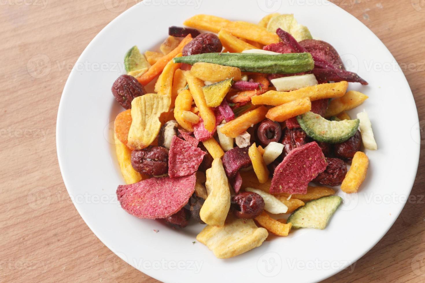 Mixed healthy vegetable chips with okra, carrots, pumpkin, beetroot and shiitake mushrooms. photo