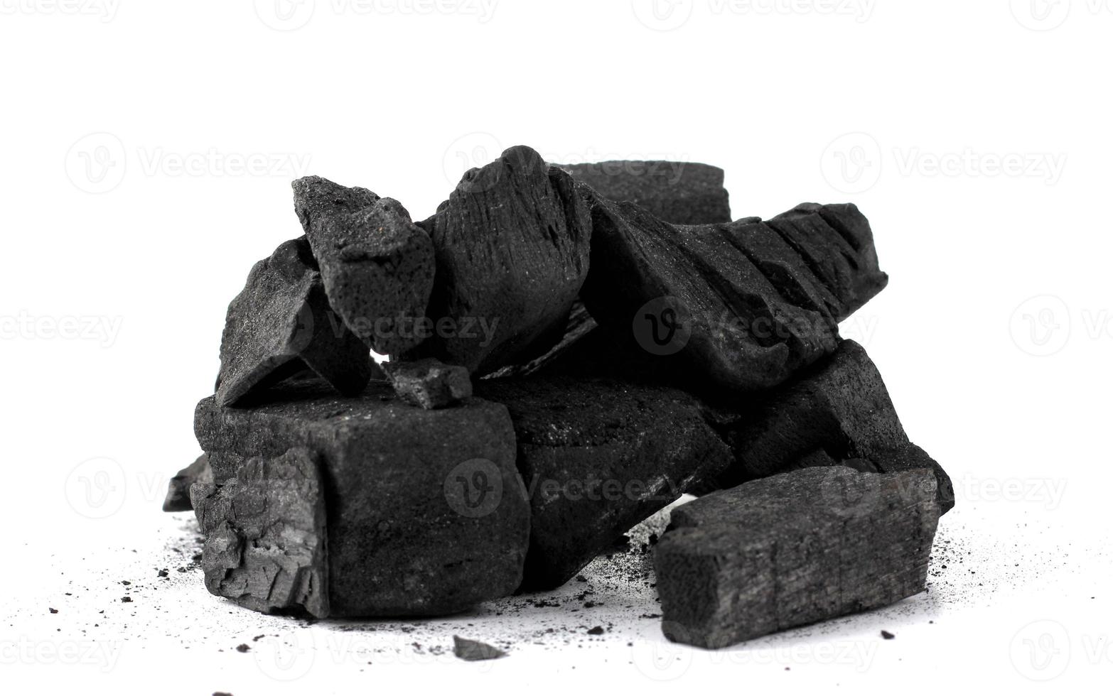 Pile of natural wood charcoal Isolated on white background. photo