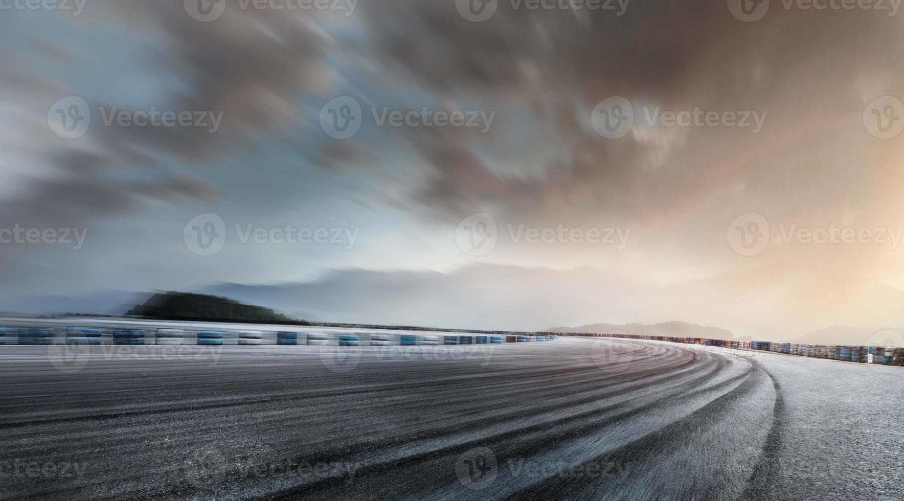 Empty long mountain road to the horizon on a sunny summer day at a bright sunset - speed motion blur effect. photo