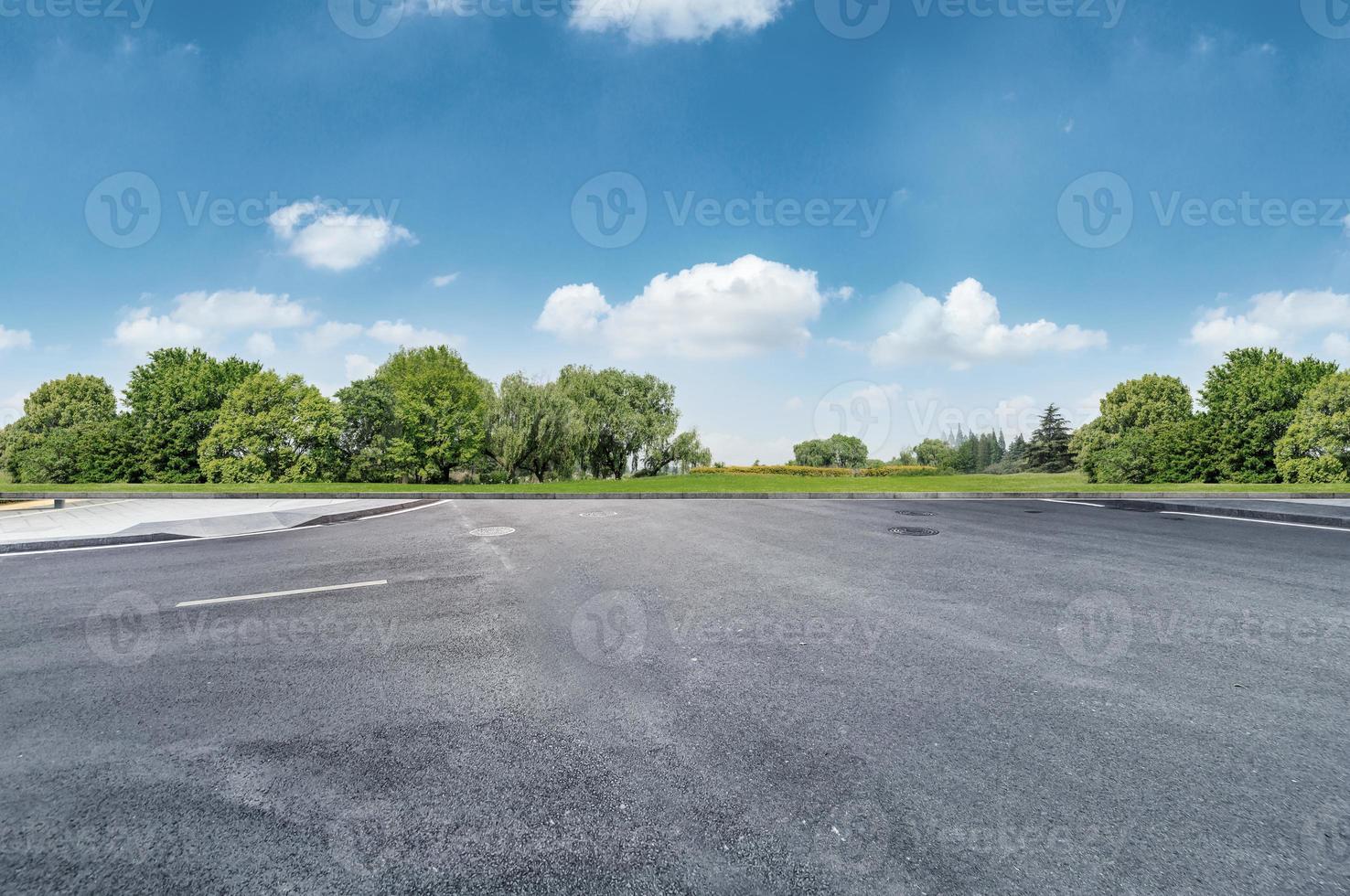 Empty road at nice and cozy garden background with nice blue sky. photo