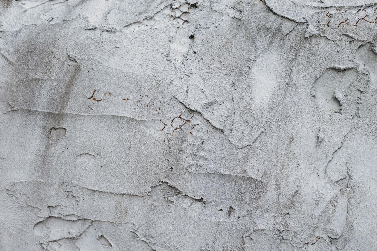Textured of the plaster wall was so uneven that the inner steel frame emerged. photo