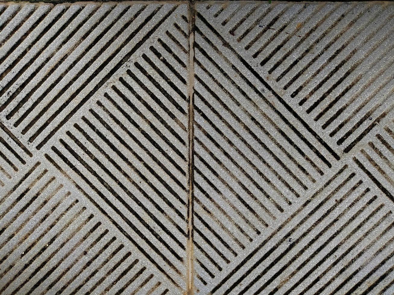 Background of gray patterned texture of floor tiles. photo