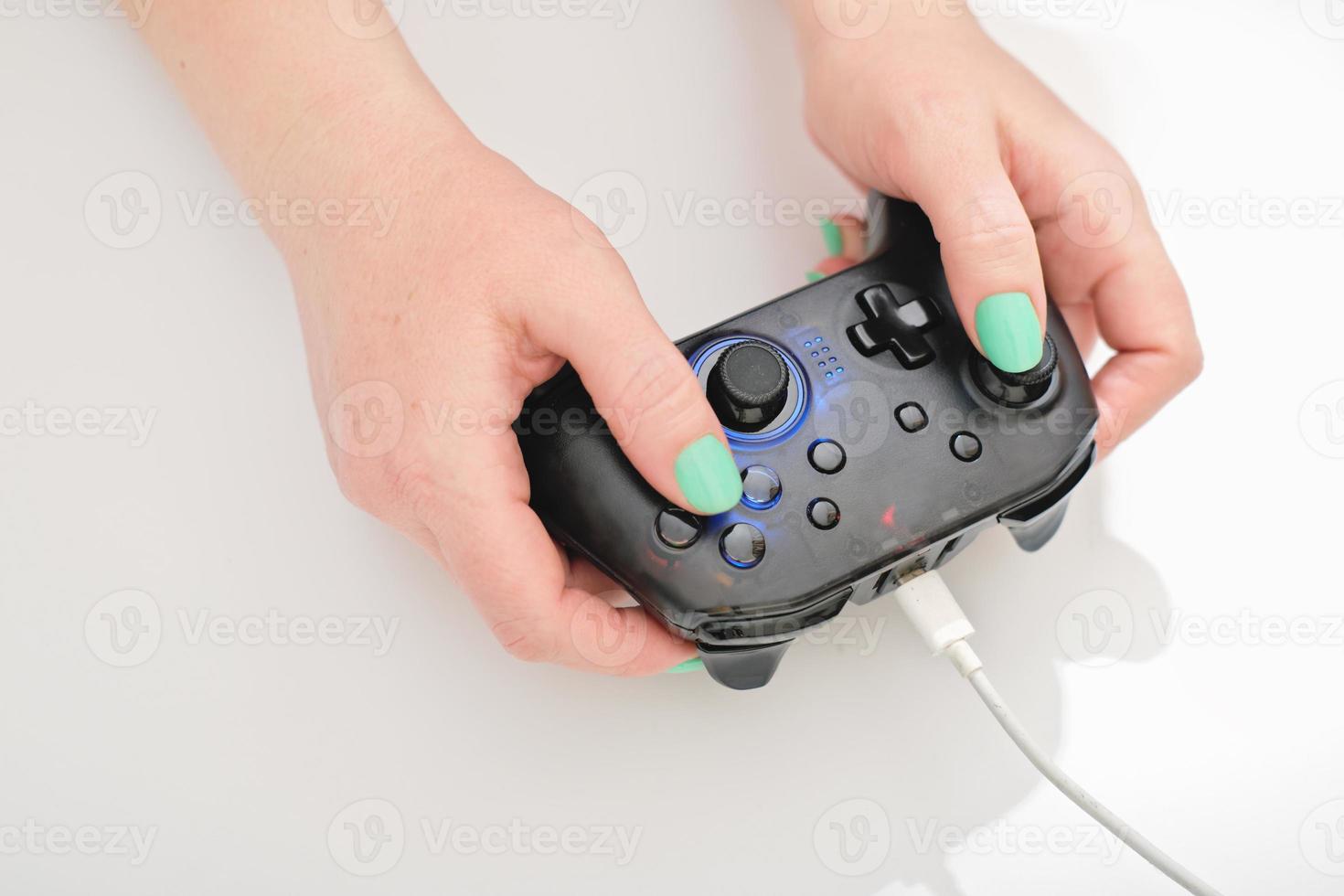 woman holding gaming controller on white background, gaming and esports challenge, streaming online, tournament concept.. woman player photo