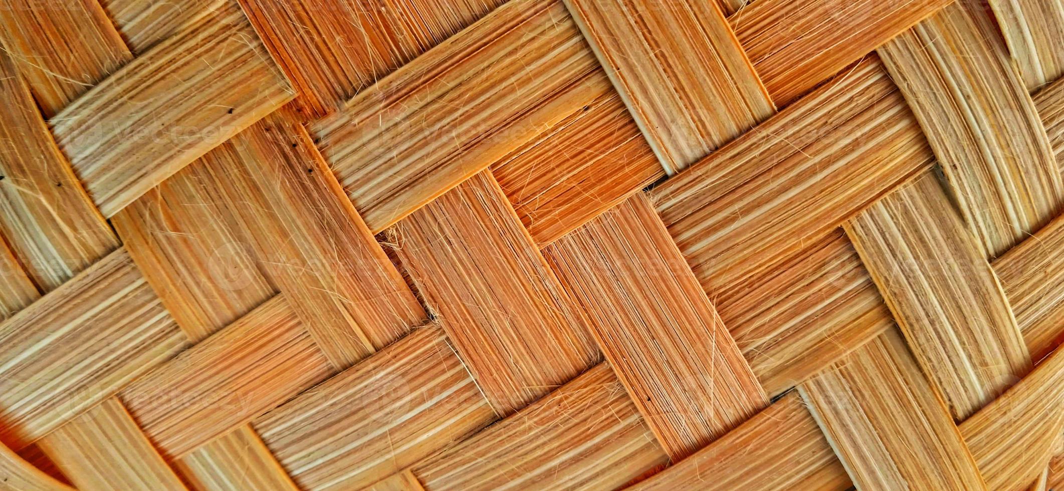 Orange bamboo weave texture or bamboo weave pattern background. Weave texture or weave pattern in classic retro style for design. photo