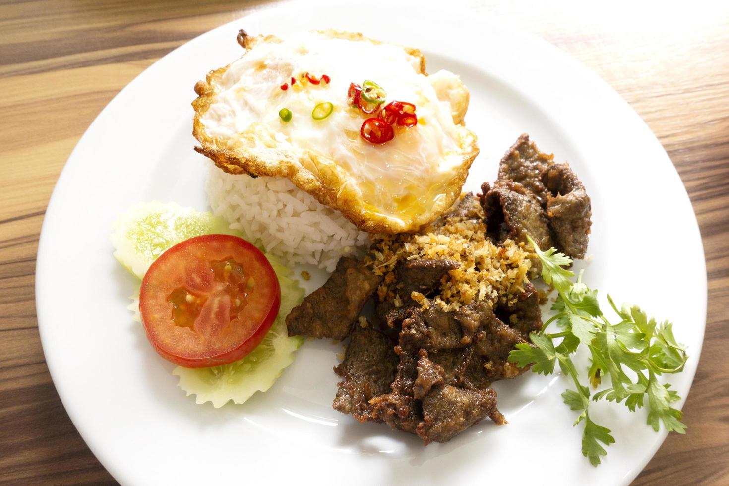 Fried rice with pork liver with fried egg photo