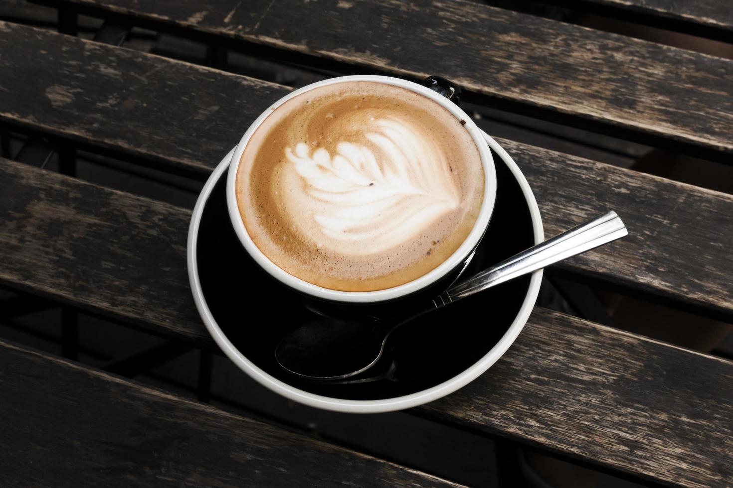 Hot Latte on Old Wood Table photo