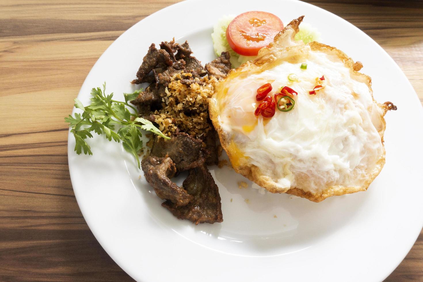 Fried rice with pork liver with fried egg photo