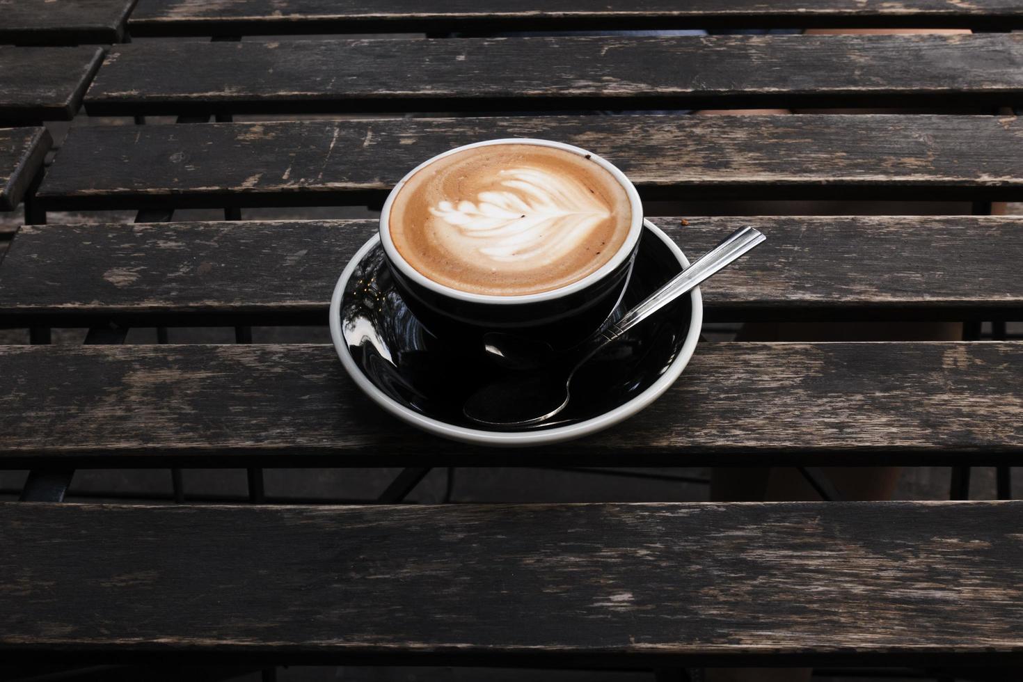 Hot Latte on Old Wood Table photo