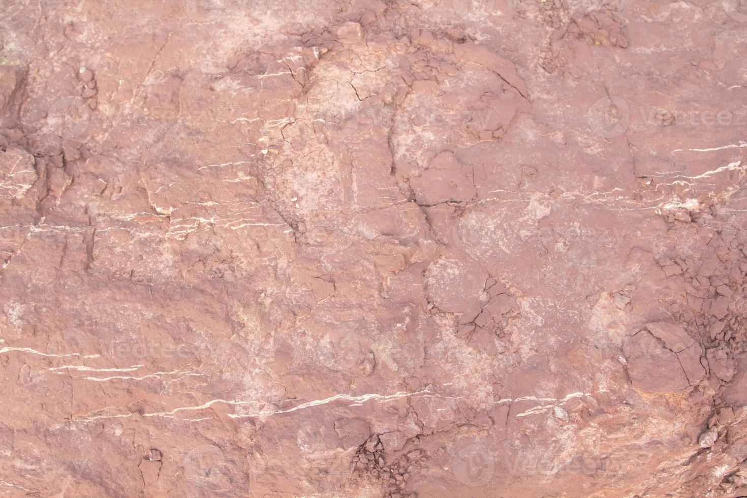 Red sandstone is a large stone used for landscaping, decorating the garden to look natural with man-made and many patterns on the surface. photo