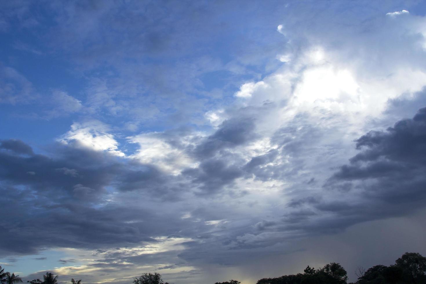 Many clouds - many colors before the sun goes down. The atmosphere was frightening as if the summer storms and heavy rains were about to happen. photo