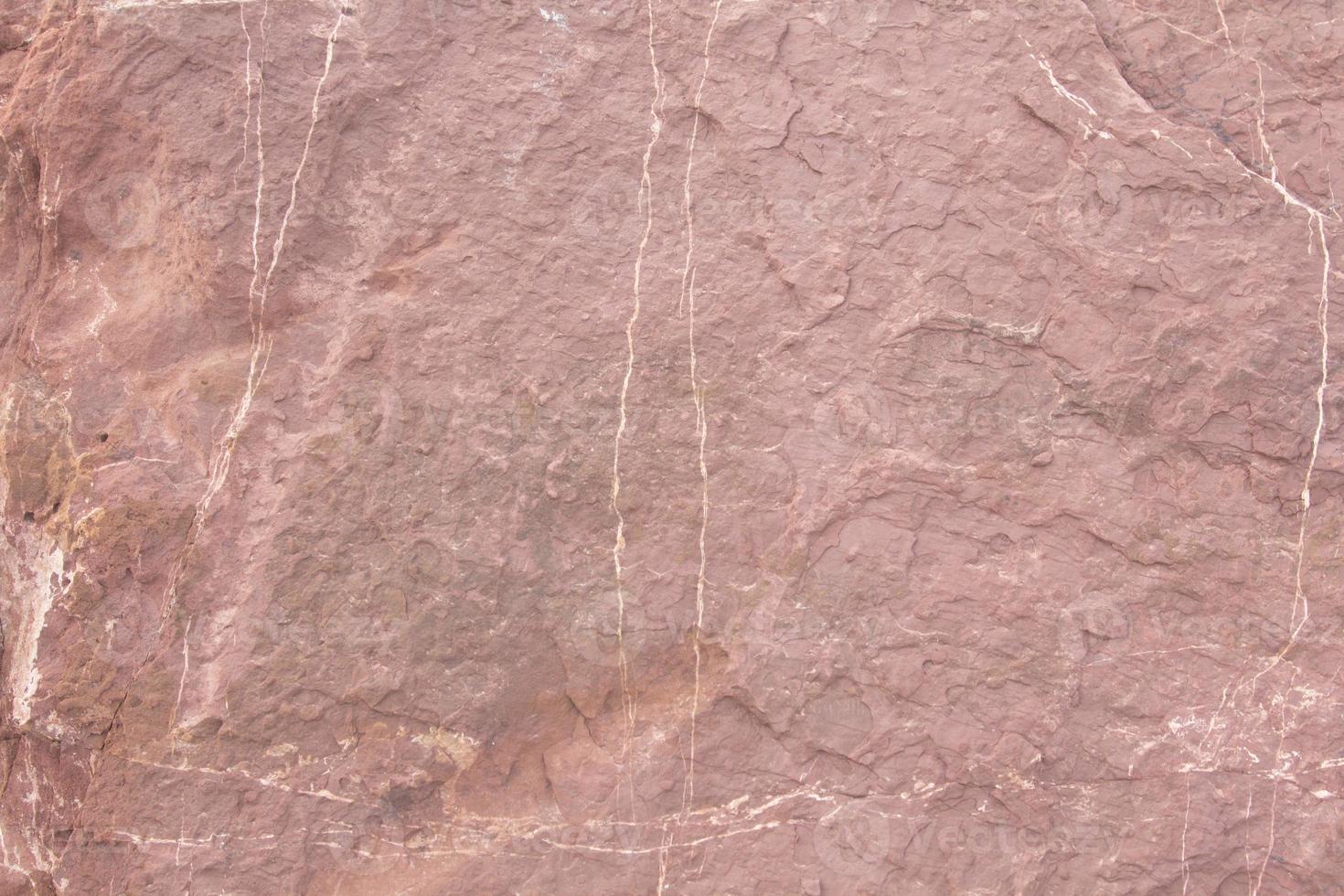Red sandstone is a large stone used for landscaping, decorating the garden to look natural with man-made and many patterns on the surface. photo