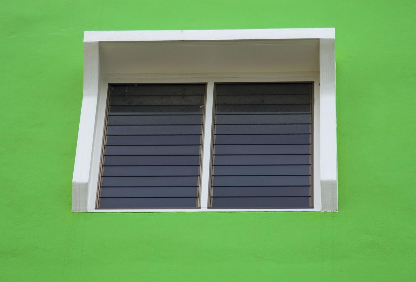 Light green walls and glass windows let the sunlight through. Beautiful patterns in high-rise buildings are designed according to construction engineering and decoration to be durable and permanent. photo