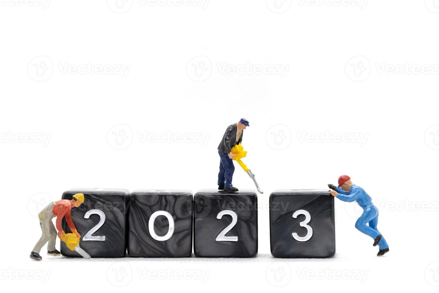 Miniature People Worker Team Create Number 2023 On Block photo