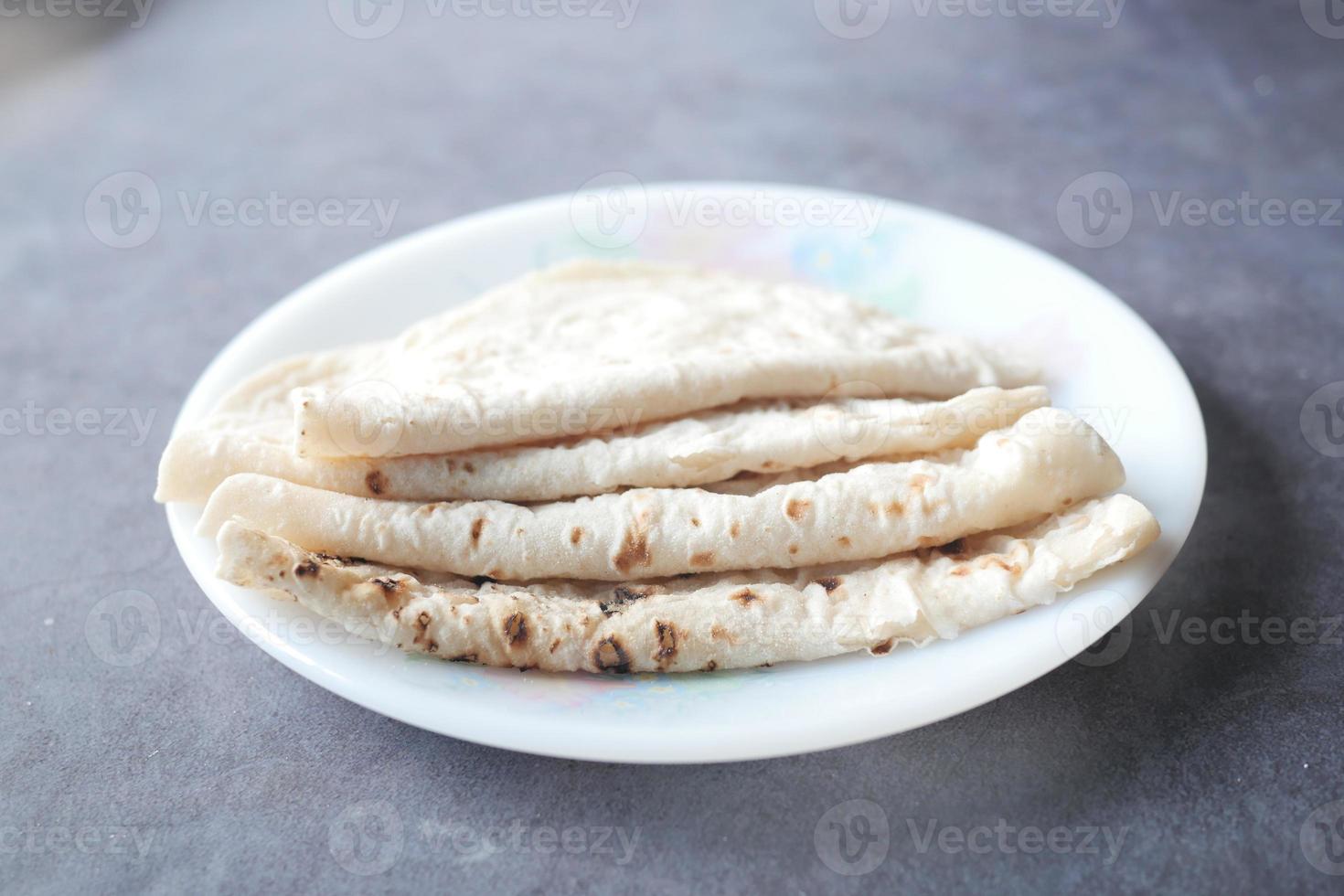 homemade roti chapati on table . photo