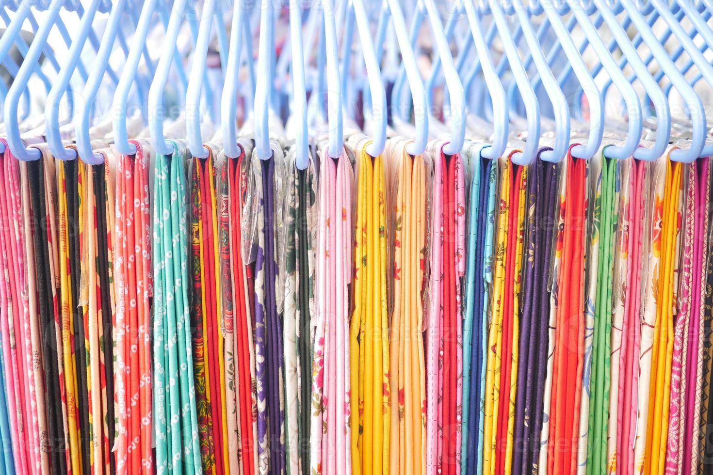 close up of many asian cloths display for sale photo