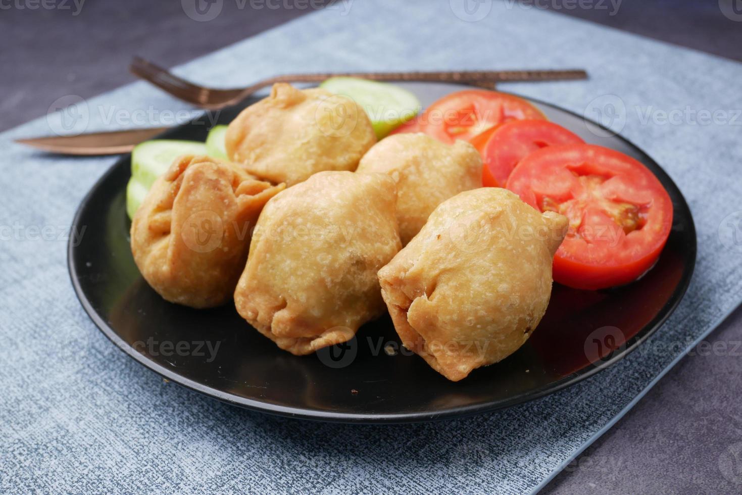 detail shot of a indian food singara on plate photo