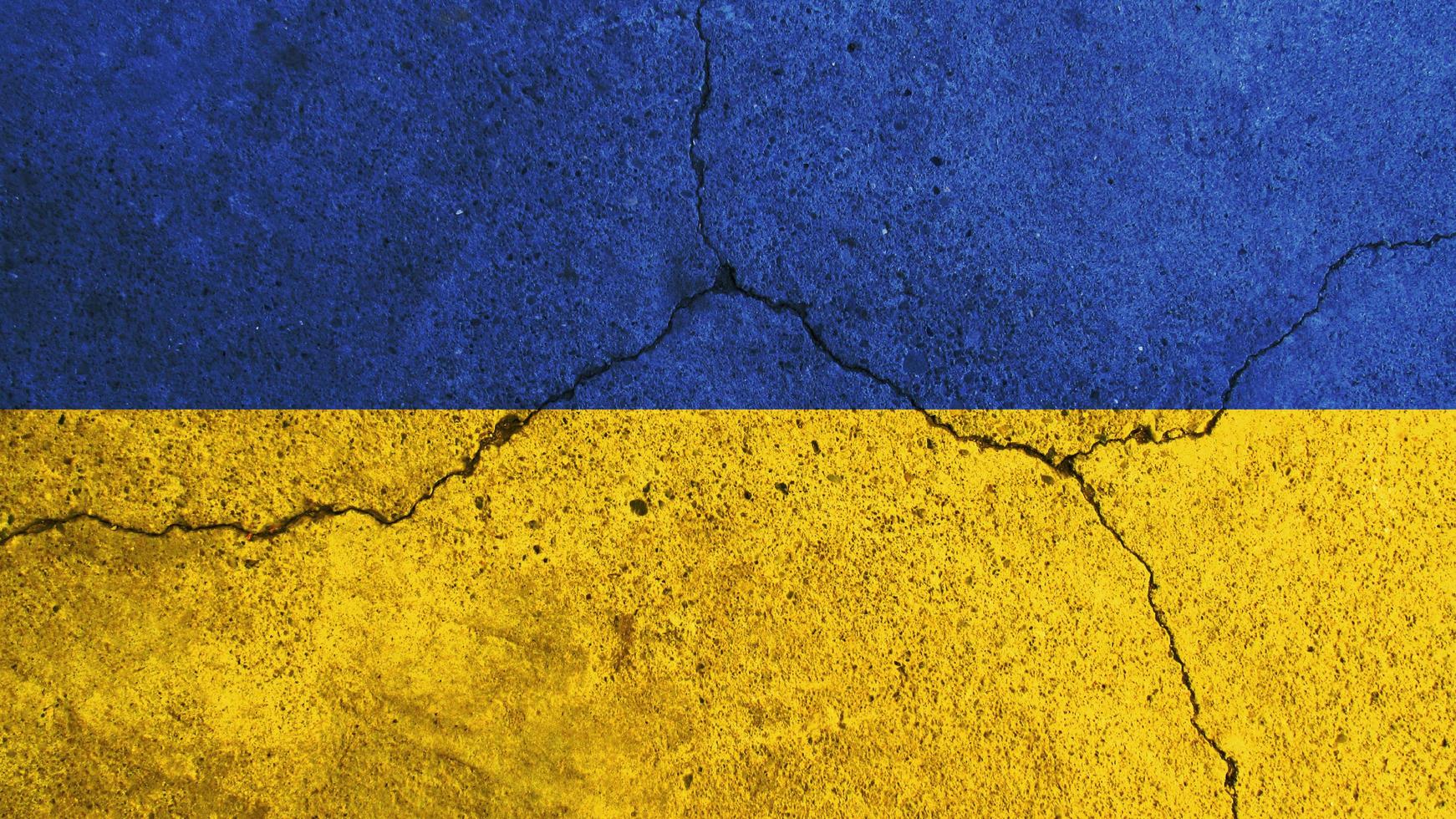 Ukraine flag. Ukraine flag on cracked cement wall photo