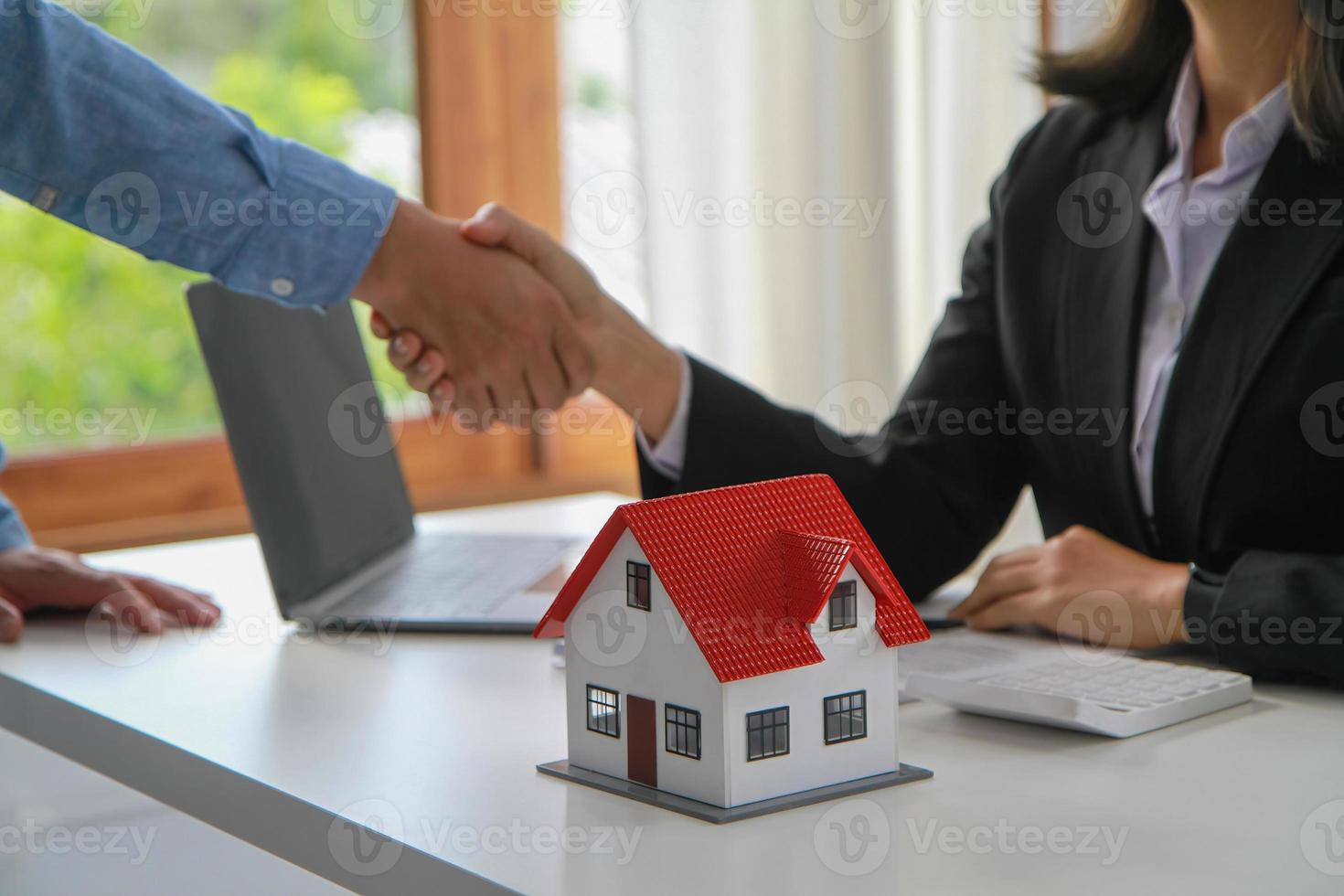 Guarantees, Mortgages, Signings, contract, agreement concept, Real estate agents shake hands with clients after signing the contract and congratulate them after reaching an agreement. photo