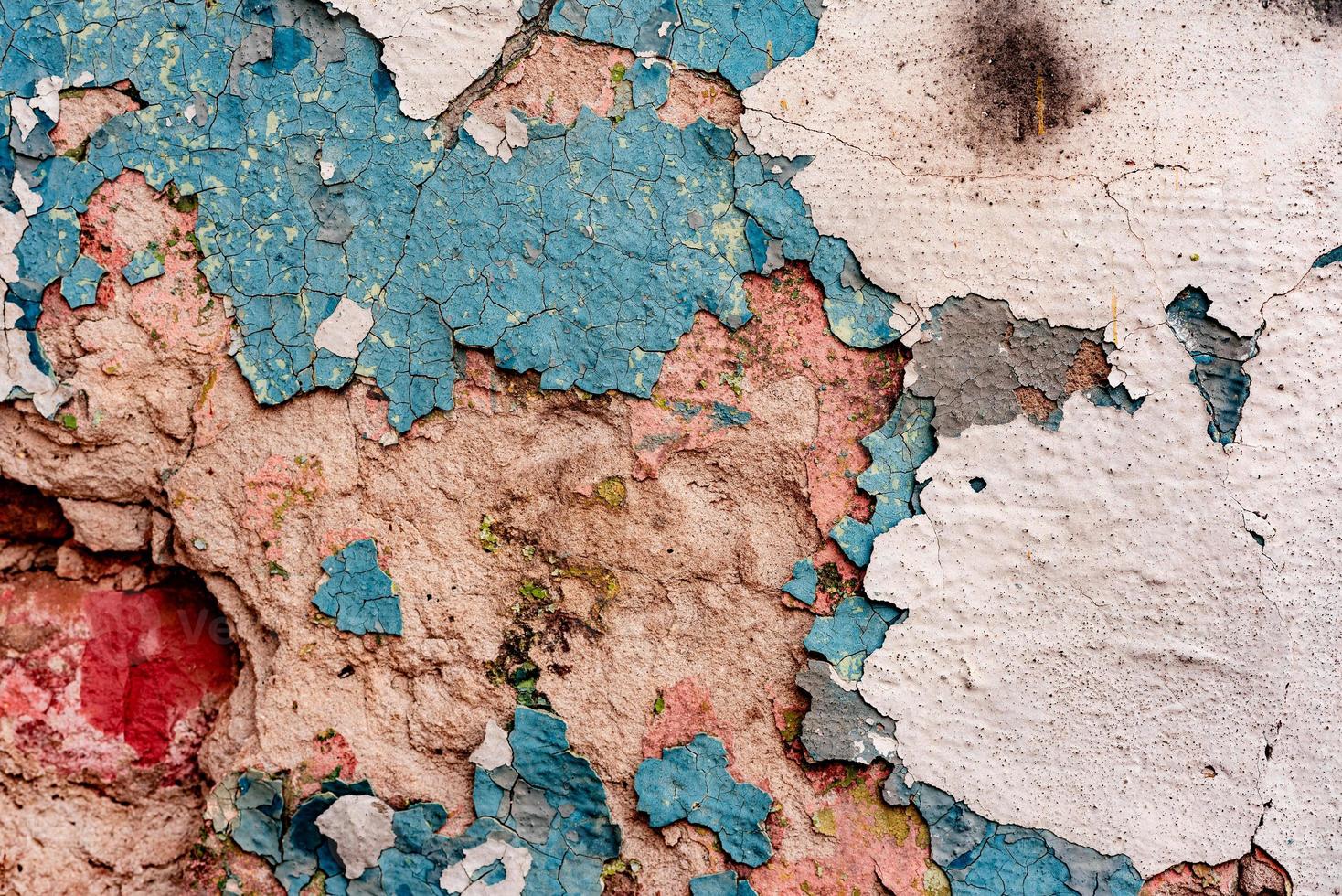 Texture of a concrete wall with cracks and scratches which can be used as a background photo