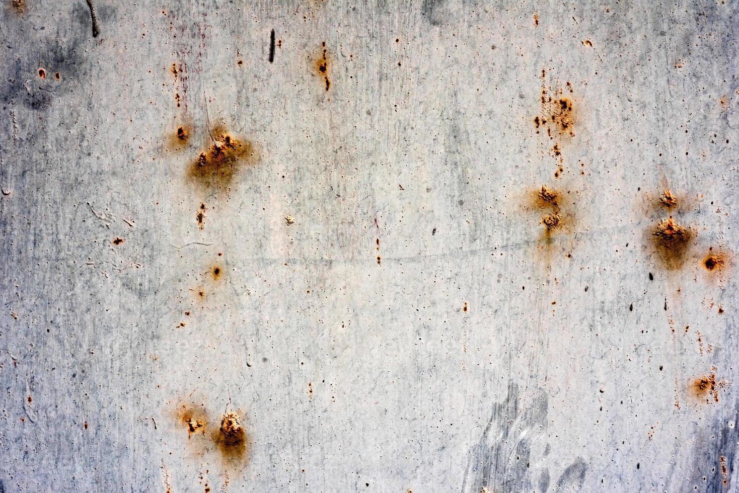 Metal texture with scratches and cracks which can be used as a background photo