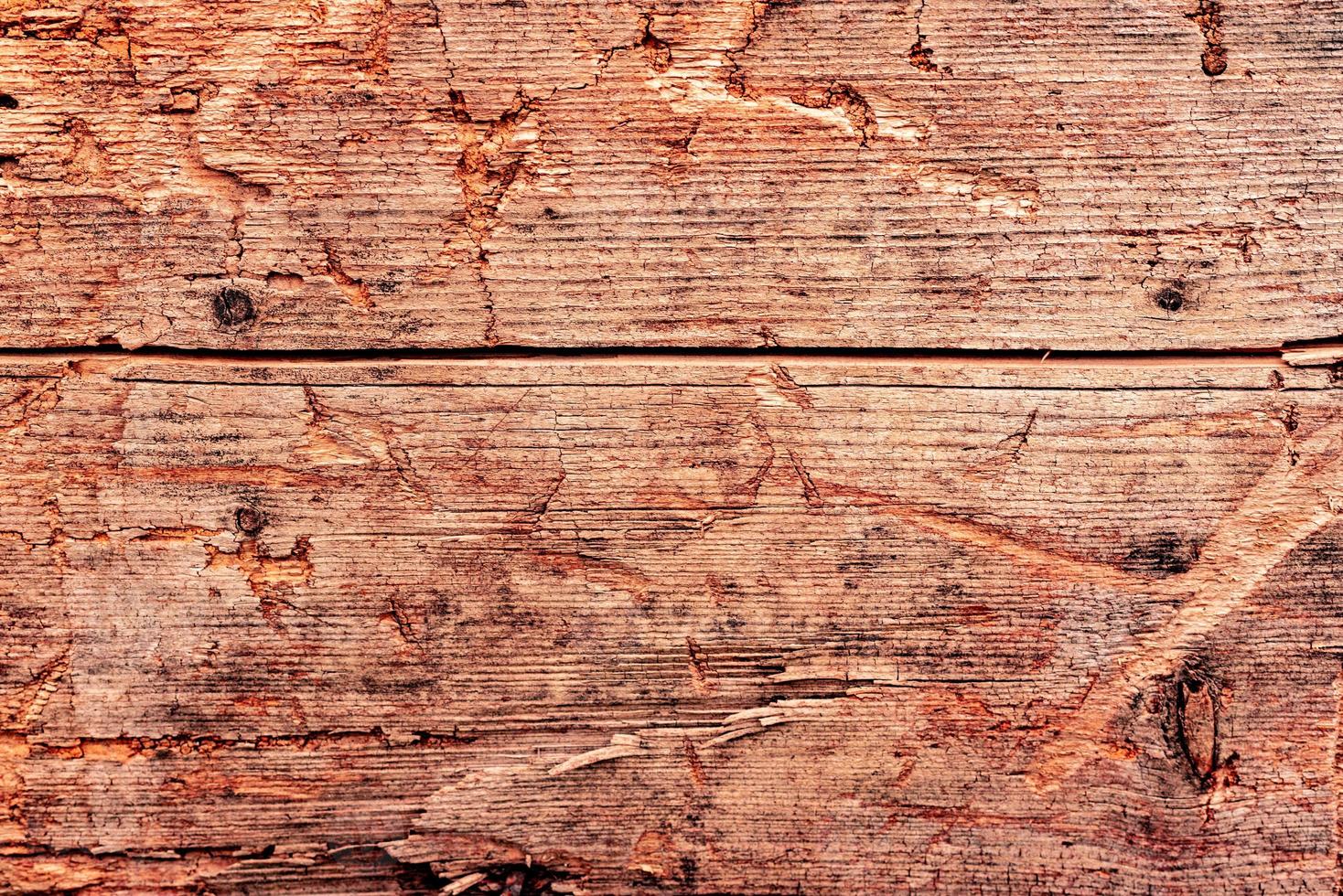 Wooden texture with scratches and cracks. It can be used as a background photo