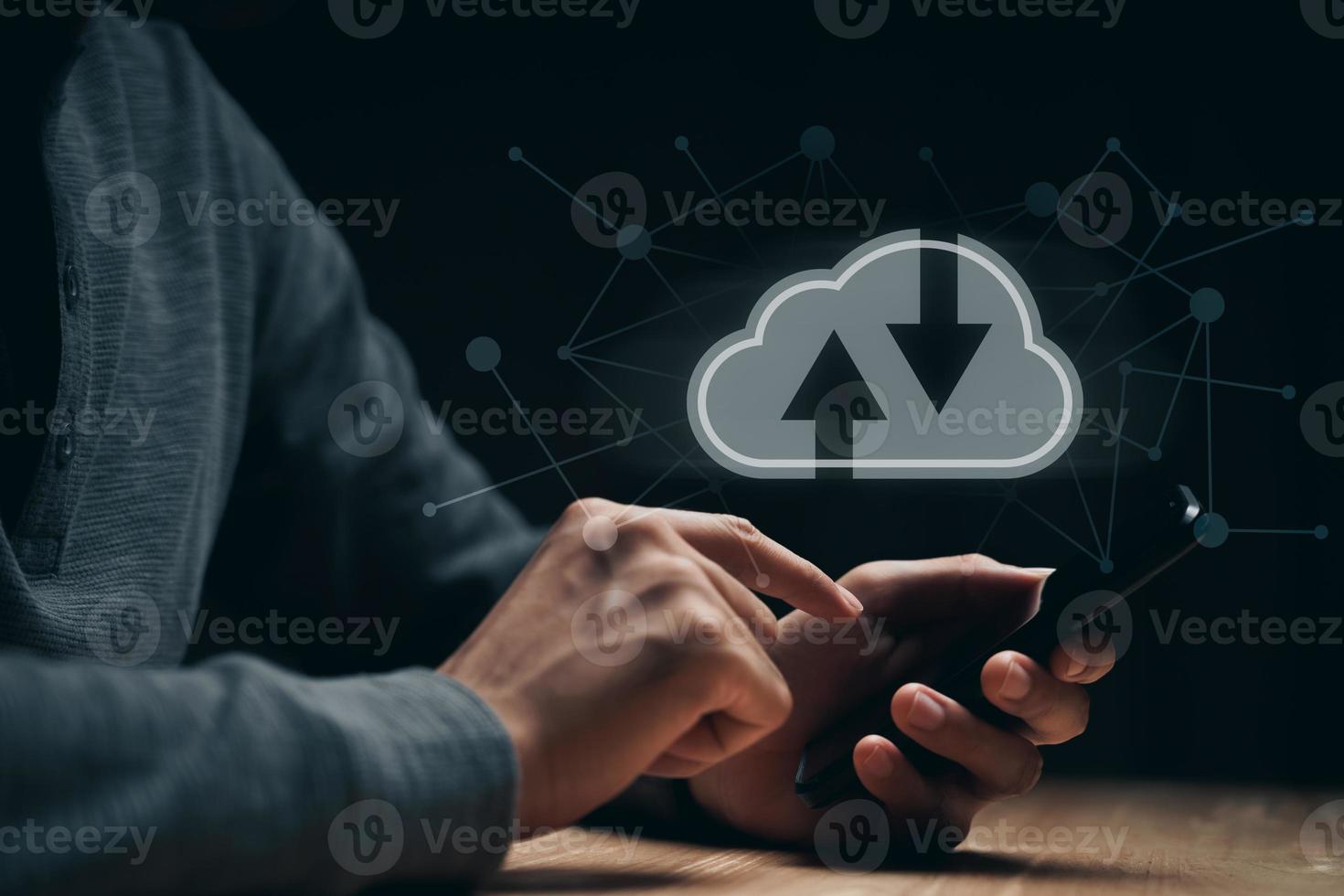 Man using smartphone with virtual cloud computing with connection line.Cloud computing system for sharing download and upload big data information. photo