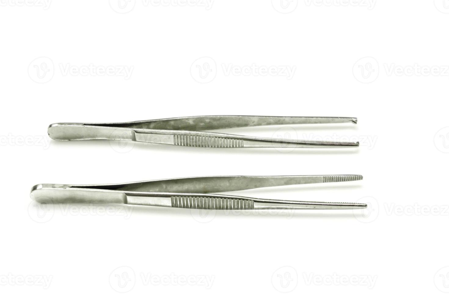 Surgical tweezers isolate on white background. photo