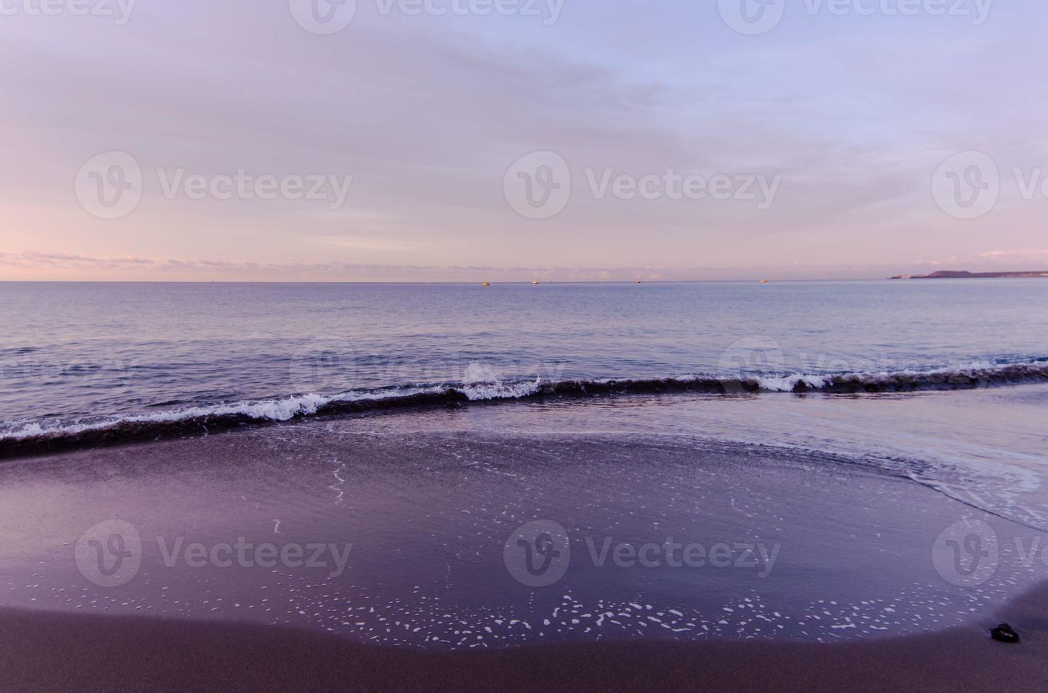 Beach and Wave at Sunrise Time photo