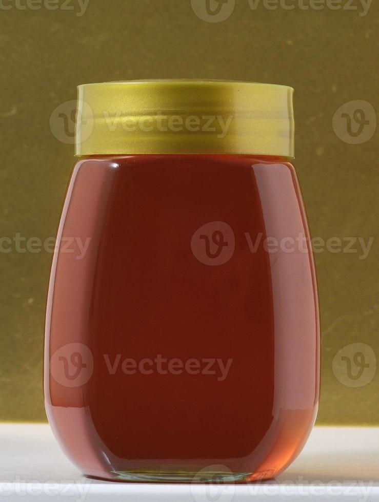 Honey Jar on table photo