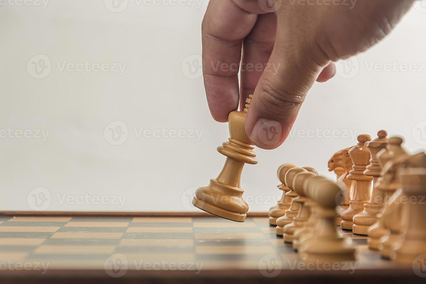 Chess on board with hand , white background photo