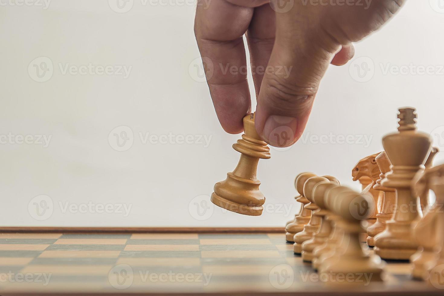 Chess on board with hand , white background photo